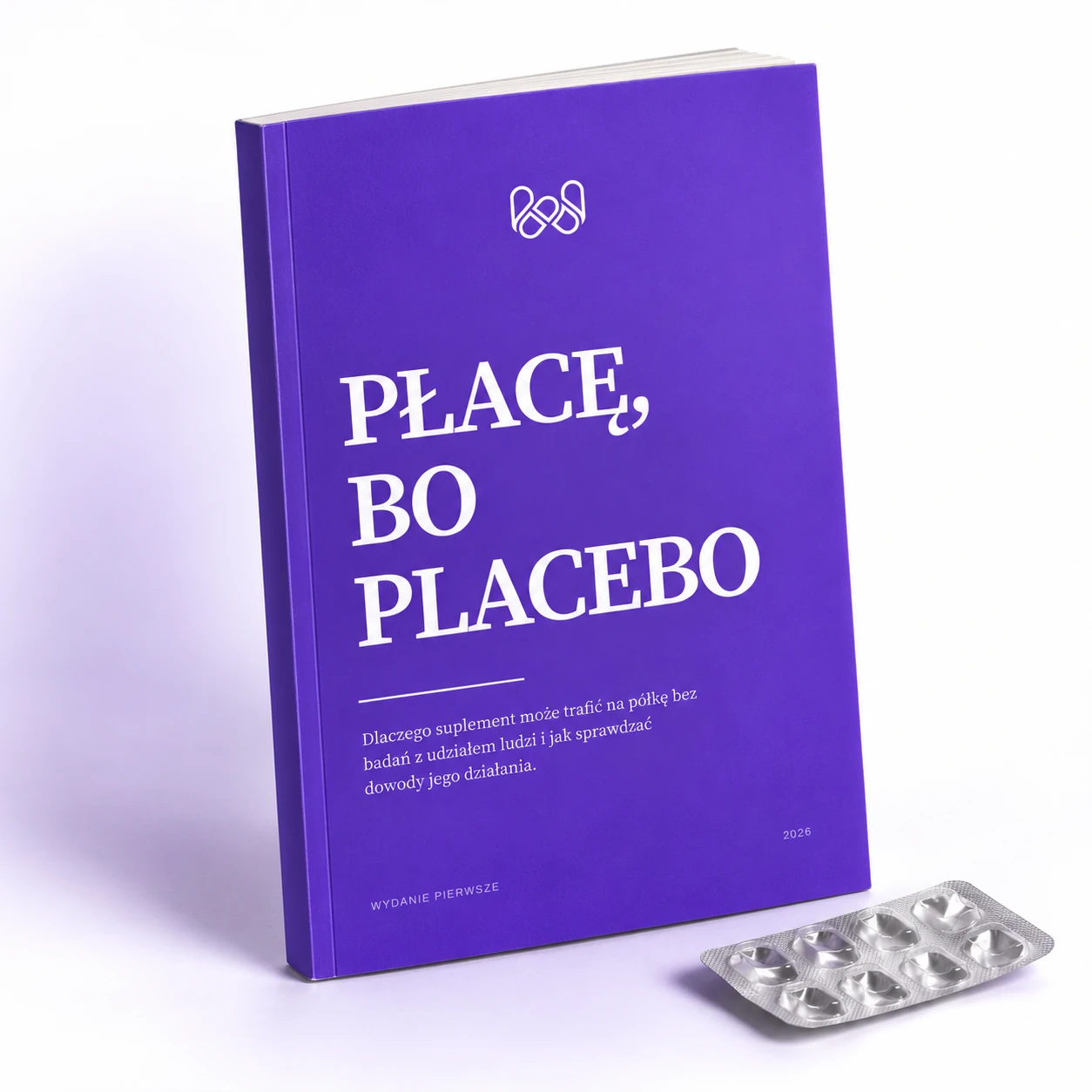 Płacę, bo placebo: fioletowa okładka Właściwości obok pustego blistra